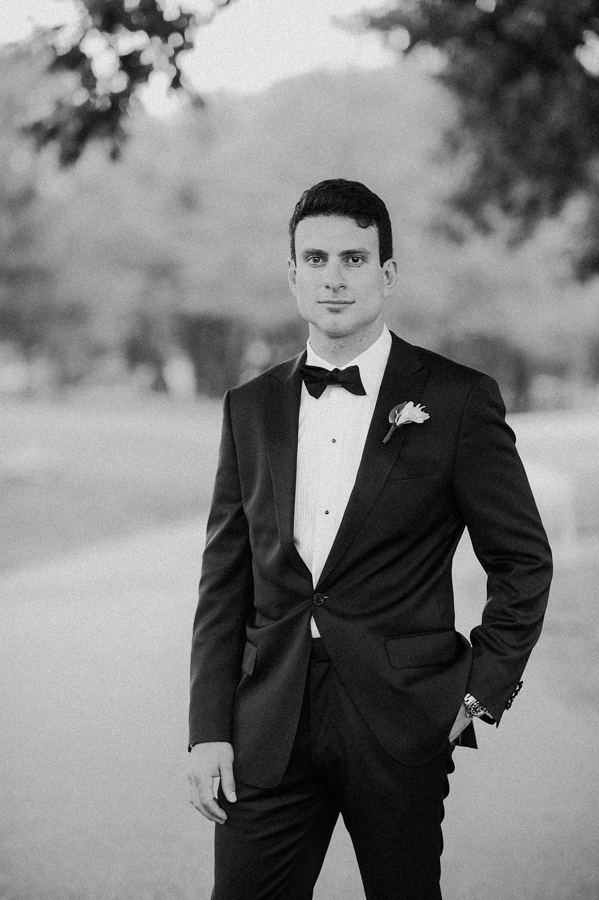 handsome groom in black and white